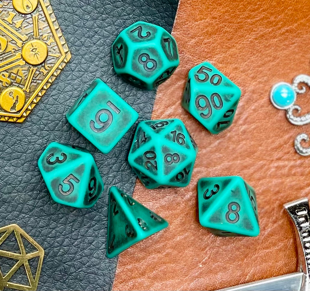 Ancient Green stone effect resin polyhedral dice set. Yet another reason to add to your growing dice collection with these fantastic resin dice. They are standard 16mm polyhedral dice sets perfect for Tabletop games and RPG's such as pathfinder or dungeons and dragons. This set includes one of each D20, D12, D10, D%, D8, D6, D4.