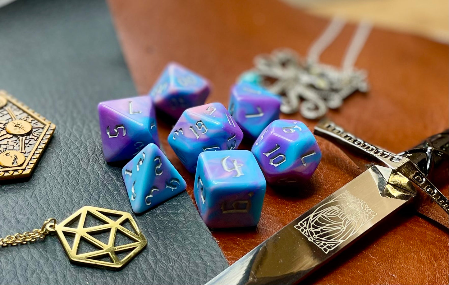 Anemone Polyhedral Dice Set Roll with style with these bubblegum pink and blue marbled resin polyhedral dice set. They are standard 16mm polyhedral dice sets perfect for Tabletop games and RPG's such as pathfinder or dungeons and dragons. This set includes one of each D20, D12, D10, D%, D8, D6, D4.