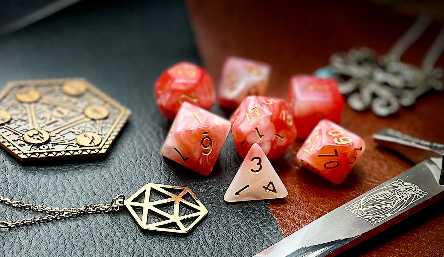 Blood Jade resin polyhedral dice set. Yet another reason to add to your growing dice collection with these fantastic resin dice. Combining red, ivory and white swirls, each dice has its own unique pattern. They are standard 16mm polyhedral dice sets perfect for Tabletop games and RPG's such as pathfinder or dungeons and dragons. This set includes one of each D20, D12, D10, D%, D8, D6, D4.