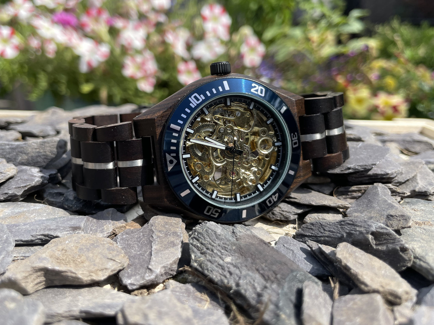 Black Wood & Blue Cog Style Interlocking Strap Self Winding Wooden Eco Watch
Made from solid wood with silver and blue anodised stainless steel; these watches are both comfortable to wear and a unique timepiece.