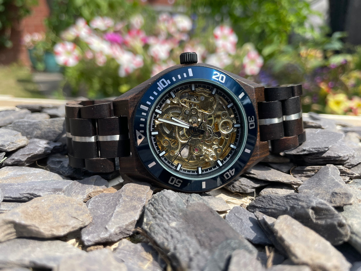 Black Wood & Blue Cog Style Interlocking Strap Self Winding Wooden Eco Watch
Made from solid wood with silver and blue anodised stainless steel; these watches are both comfortable to wear and a unique timepiece.
