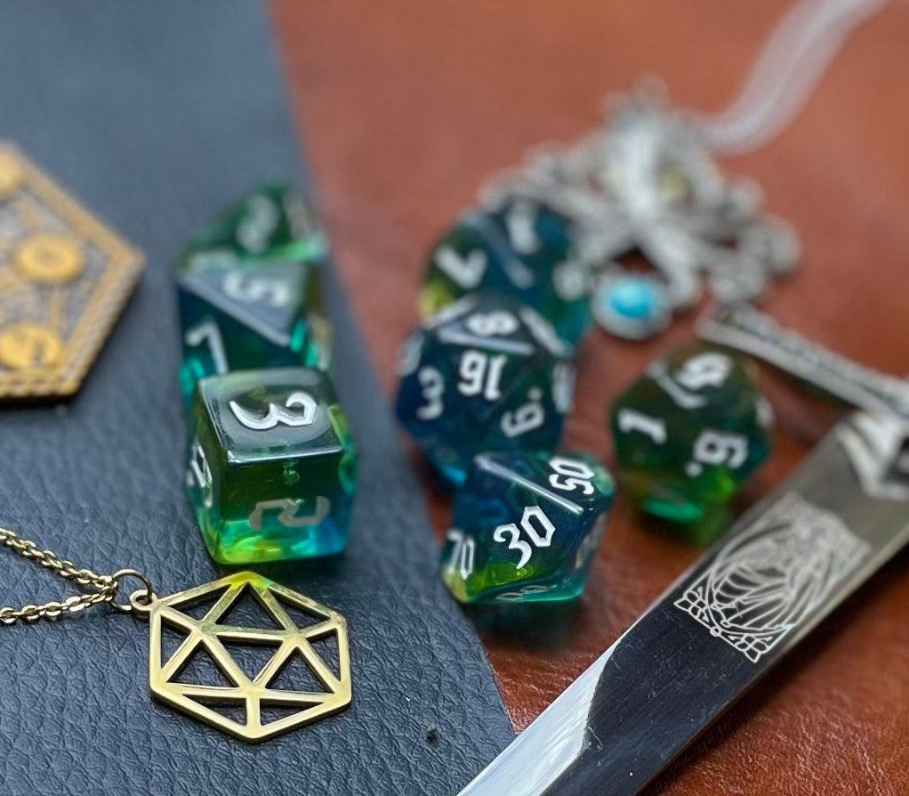 Elemental agean sea resin polyhedral dice set. Delve into the Mediterranean waters with these fantastic resin dice. Combining translucent green and blues; each dice has its own unique pattern.