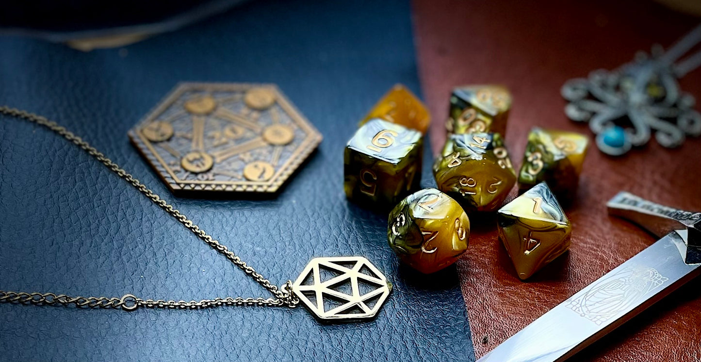 Elemental gold and black resin polyhedral dice set. Unleash the fury of the fire elemental spirits with these fantastic resin dice. Combining gold and black swirls; each dice has its own unique pattern.