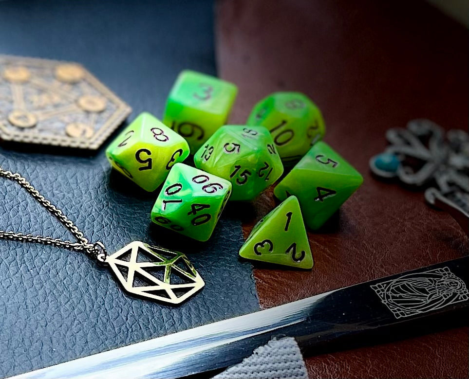Elemental Yellow and Green resin polyhedral dice set. Awaken the elements with these fantastic resin dice. Combining vibrant yellow and green swirls; each dice has its own unique pattern. They are standard 16mm polyhedral dice sets perfect for Tabletop games and RPG's such as pathfinder or dungeons and dragons. This set includes one of each D20, D12, D10, D%, D8, D6, D4.