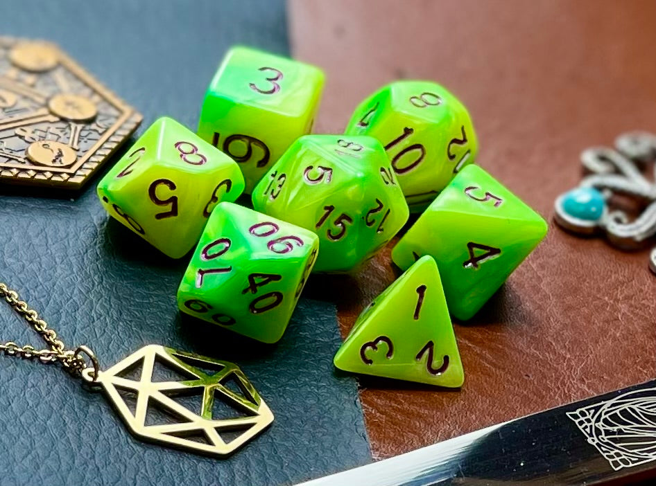 Elemental Yellow and Green resin polyhedral dice set. Awaken the elements with these fantastic resin dice. Combining vibrant yellow and green swirls; each dice has its own unique pattern. They are standard 16mm polyhedral dice sets perfect for Tabletop games and RPG's such as pathfinder or dungeons and dragons. This set includes one of each D20, D12, D10, D%, D8, D6, D4.