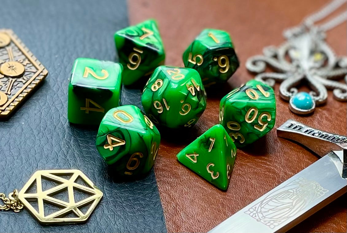 Elemental green and black resin polyhedral dice set. Unleash the fury of the earth elemental spirits with these fantastic resin dice. Combining green and black swirls; each dice has its own unique pattern.