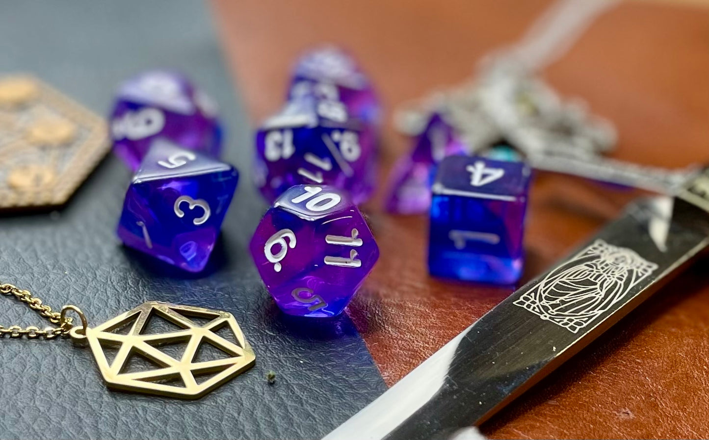 Elemental Indigo Sea resin polyhedral dice set. Delve to the bottom of the fabled Indigo Seas with these fantastic resin dice. Combining translucent green and blues; each dice has its own unique pattern. They are standard 16mm polyhedral dice sets perfect for Tabletop games and RPG's such as pathfinder or dungeons and dragons This set includes one of each D20, D12, D10, D%, D8, D6, D4.