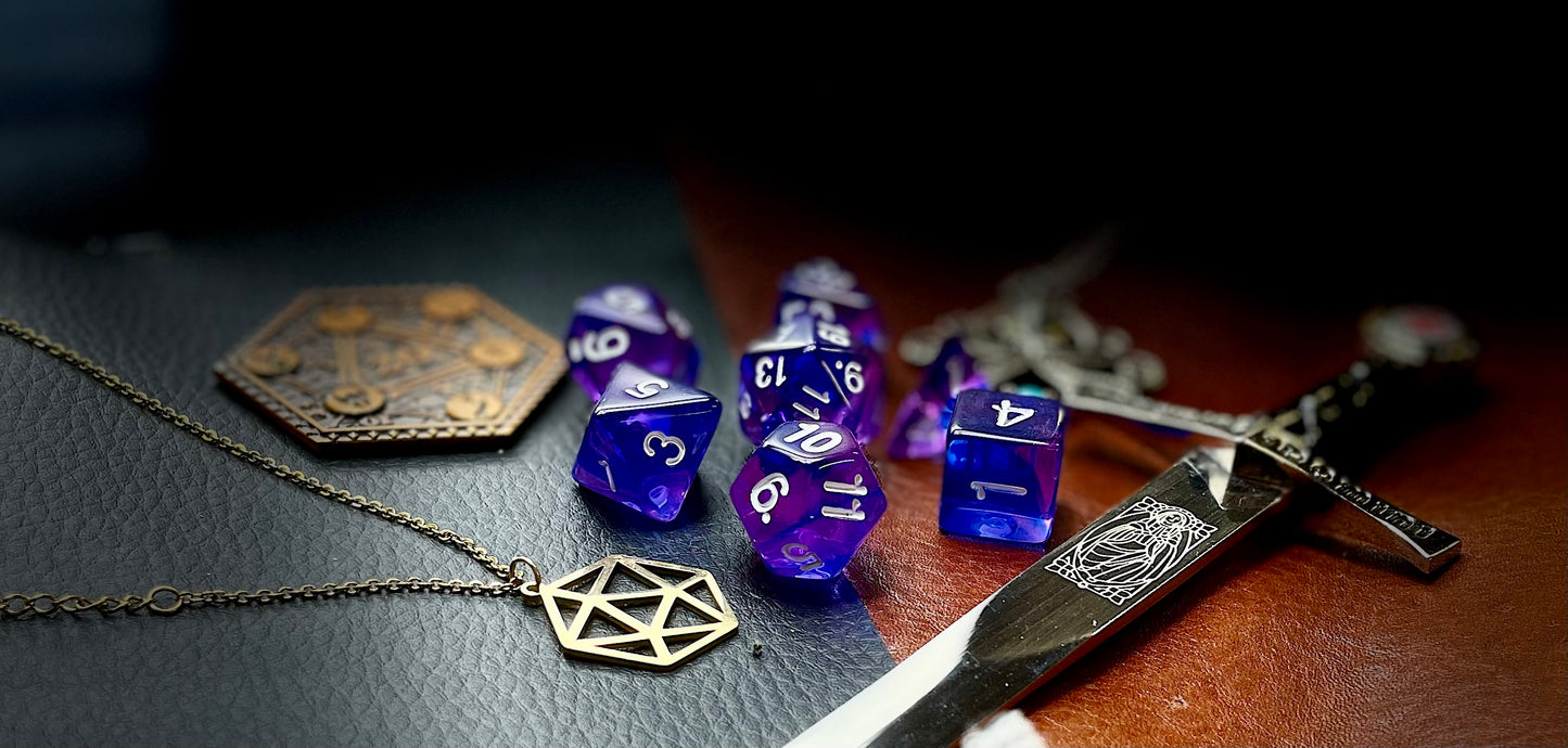 Elemental Indigo Sea resin polyhedral dice set. Delve to the bottom of the fabled Indigo Seas with these fantastic resin dice. Combining translucent green and blues; each dice has its own unique pattern. They are standard 16mm polyhedral dice sets perfect for Tabletop games and RPG's such as pathfinder or dungeons and dragons This set includes one of each D20, D12, D10, D%, D8, D6, D4.