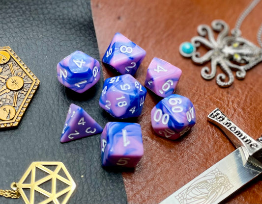 Elemental Pink and Blue resin polyhedral dice set.  Awaken the elements with these fantastic resin dice. Combining vibrant baby blue and pinks; each dice has its own unique pattern.  They are standard 16mm polyhedral dice sets perfect for Tabletop games and RPG's such as pathfinder or dungeons and dragons.  This set includes one of each D20, D12, D10, D%, D8, D6, D4.