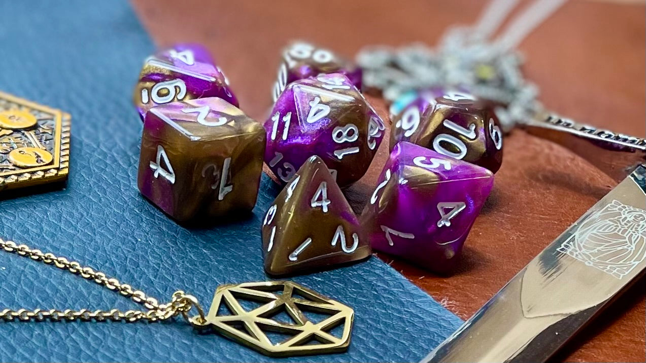 Unknown Dimension Polyhedral Dice Sett Traverse the stars with these red and green swirl resin polyhedral dice set. They are standard 16mm polyhedral dice sets perfect for Tabletop games and RPG's such as pathfinder or dungeons and dragons. This set includes one of each D20, D12, D10, D%, D8, D6, D4.