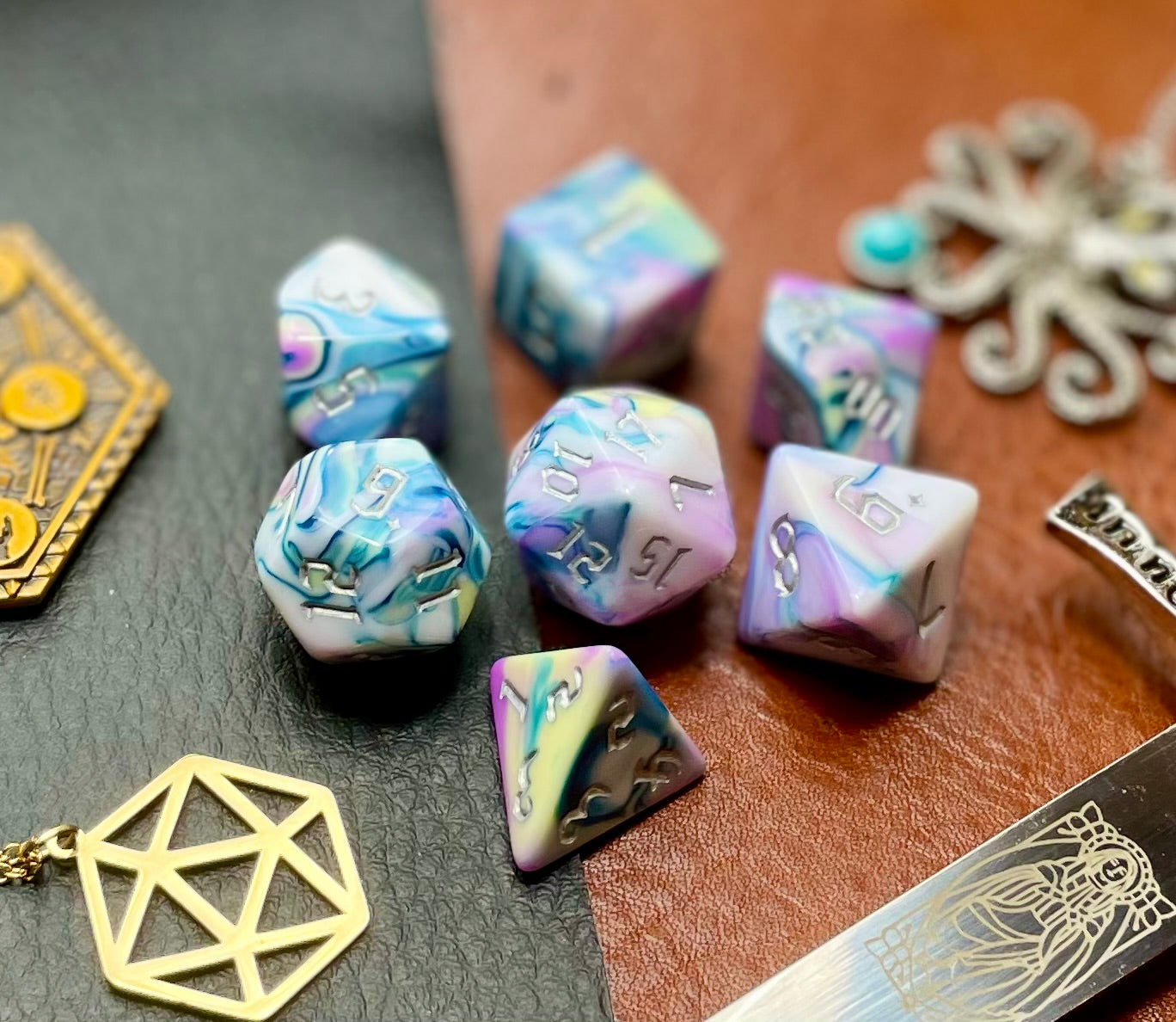 Forbidden Temple Polyhedral Dice Set Roll with style with these pink, yellow, turquoise and white marbled resin polyhedral dice set. They are standard 16mm polyhedral dice sets perfect for Tabletop games and RPG's such as pathfinder or dungeons and dragons. This set includes one of each D20, D12, D10, D%, D8, D6, D4.