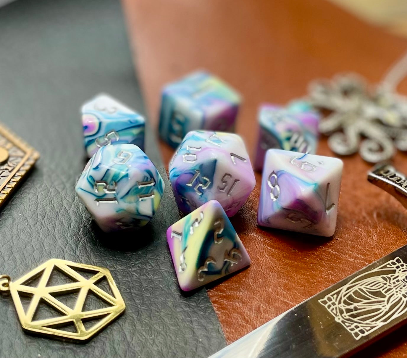 Forbidden Temple Polyhedral Dice Set Roll with style with these pink, yellow, turquoise and white marbled resin polyhedral dice set. They are standard 16mm polyhedral dice sets perfect for Tabletop games and RPG's such as pathfinder or dungeons and dragons. This set includes one of each D20, D12, D10, D%, D8, D6, D4.