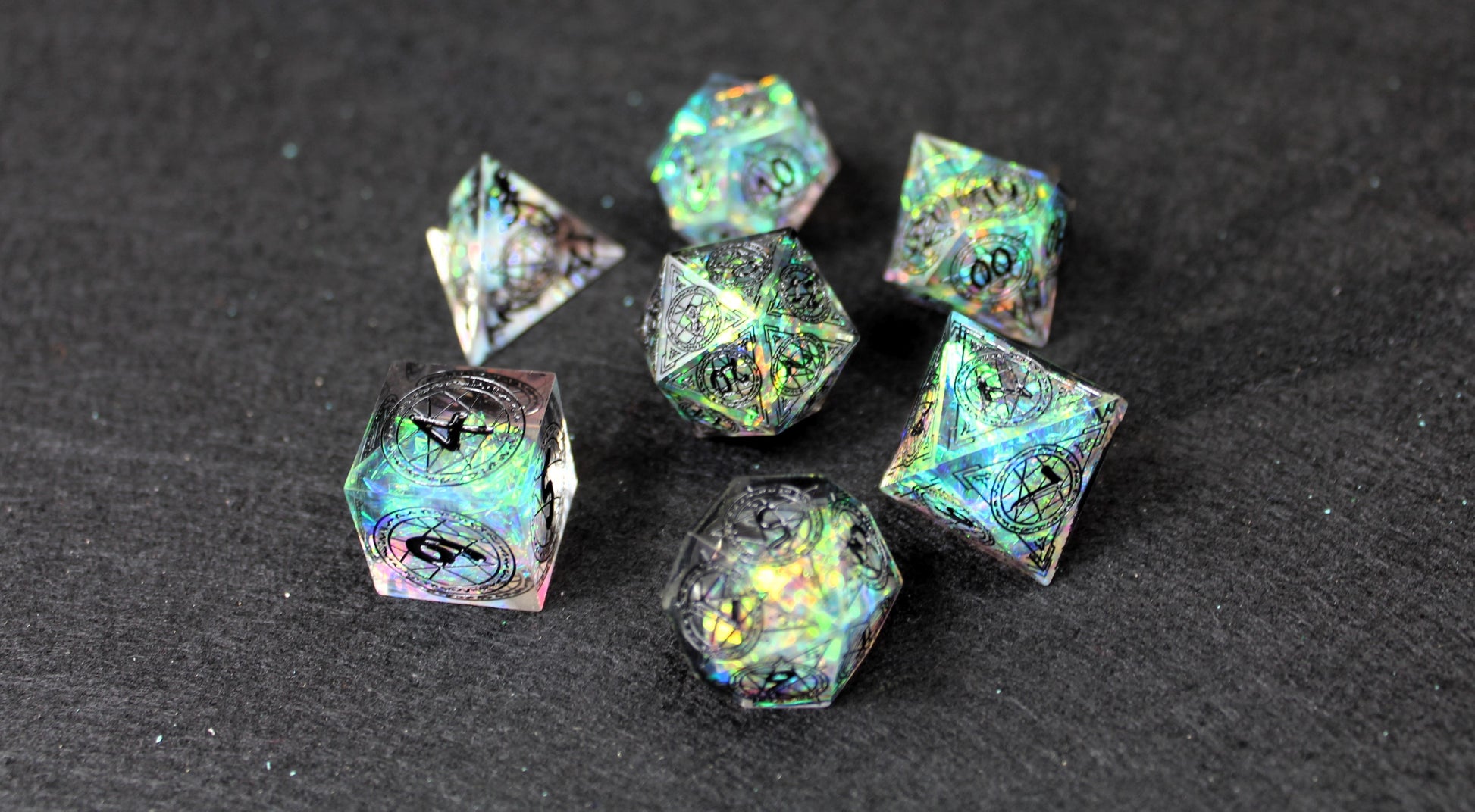 Sacred Runes Clear Glitter Sharp Edge Dice Set
Polished luxury sharp edge dice set
Roll in style with these polyhedral dice sets perfect for Tabletop games and RPG's such as pathfinder or dungeons and dragons.
This set includes one of each D20, D12, D10, D%, D8, D6, D4.
Available both with or without a PU leather dice storage box.