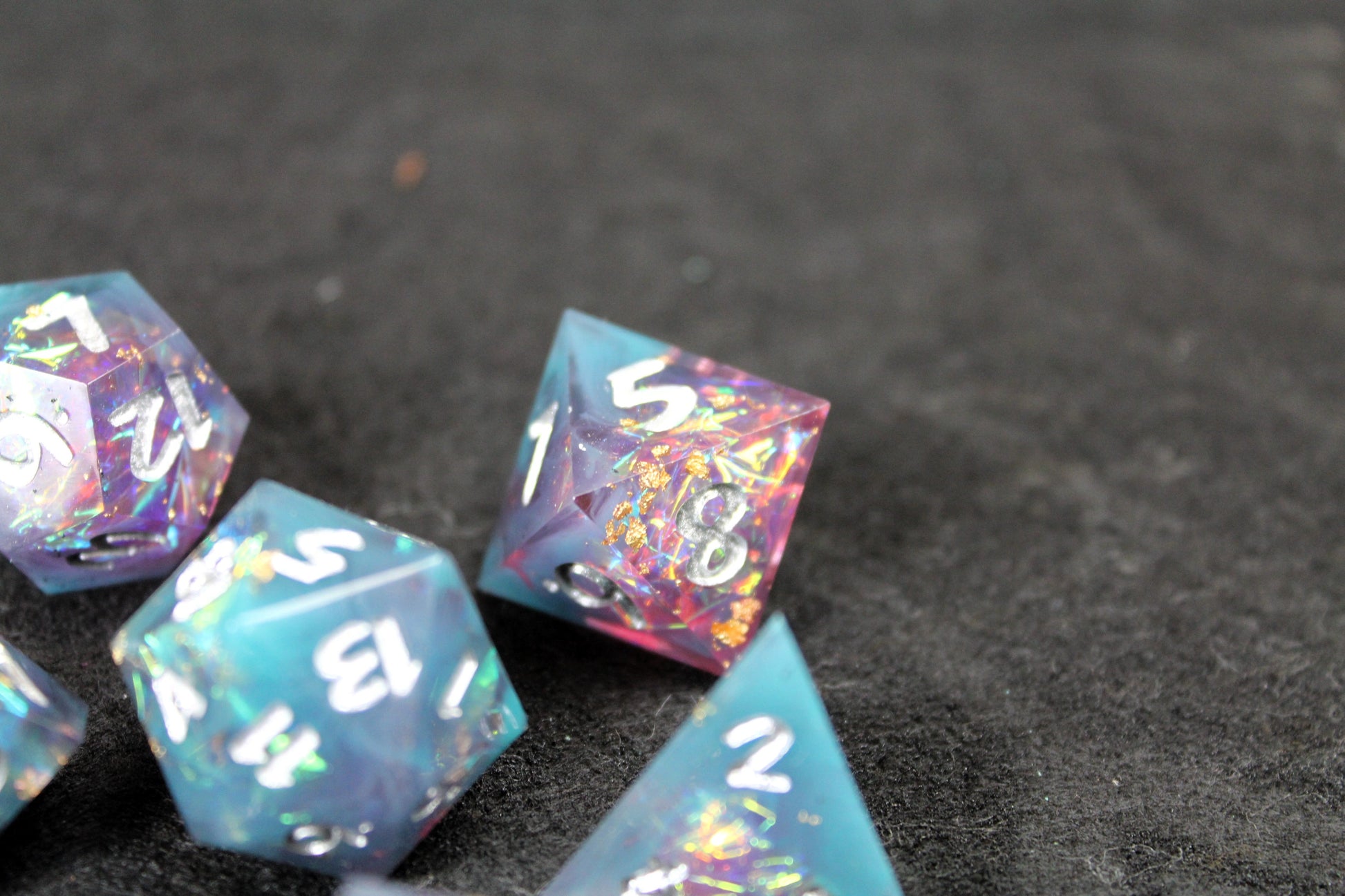 Blue and Baby Pink Glitter Sharp Edge Dice Set
Polished luxury sharp edge dice set
Roll in style with these polyhedral dice sets perfect for Tabletop games and RPG's such as pathfinder or dungeons and dragons.
This set includes one of each D20, D12, D10, D%, D8, D6, D4.
Available both with or without a PU leather dice storage box.