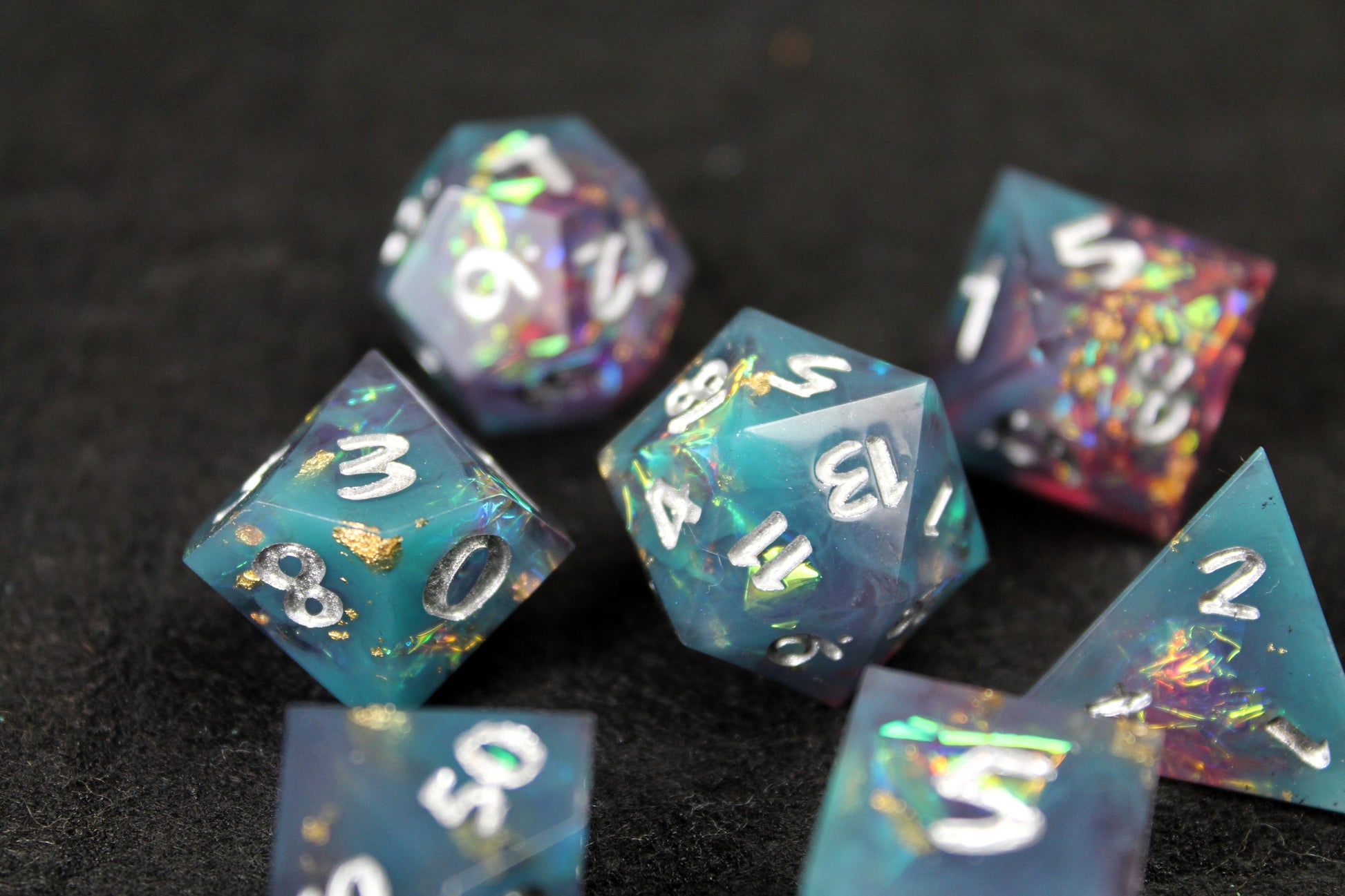 Blue and Baby Pink Glitter Sharp Edge Dice Set
Polished luxury sharp edge dice set
Roll in style with these polyhedral dice sets perfect for Tabletop games and RPG's such as pathfinder or dungeons and dragons.
This set includes one of each D20, D12, D10, D%, D8, D6, D4.
Available both with or without a PU leather dice storage box.