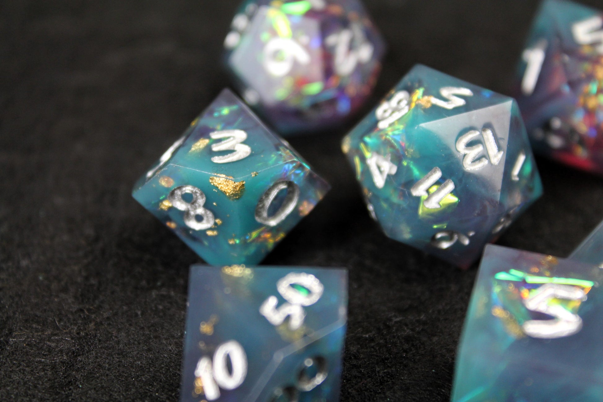 Blue and Baby Pink Glitter Sharp Edge Dice Set
Polished luxury sharp edge dice set
Roll in style with these polyhedral dice sets perfect for Tabletop games and RPG's such as pathfinder or dungeons and dragons.
This set includes one of each D20, D12, D10, D%, D8, D6, D4.
Available both with or without a PU leather dice storage box.