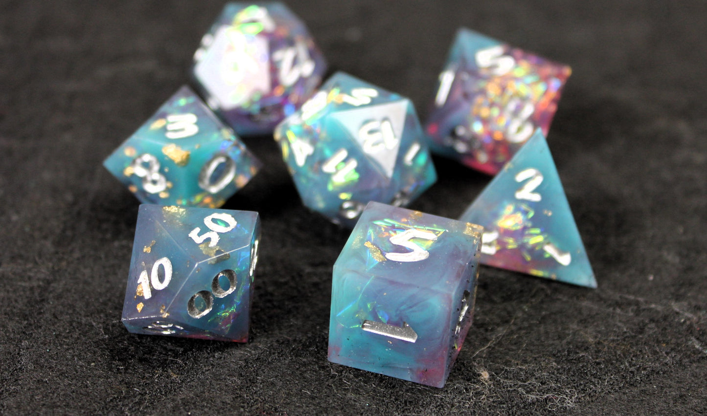 Blue and Baby Pink Glitter Sharp Edge Dice Set
Polished luxury sharp edge dice set
Roll in style with these polyhedral dice sets perfect for Tabletop games and RPG's such as pathfinder or dungeons and dragons.
This set includes one of each D20, D12, D10, D%, D8, D6, D4.
Available both with or without a PU leather dice storage box.