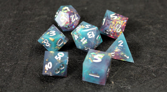 Blue and Baby Pink Glitter Sharp Edge Dice Set
Polished luxury sharp edge dice set
Roll in style with these polyhedral dice sets perfect for Tabletop games and RPG's such as pathfinder or dungeons and dragons.
This set includes one of each D20, D12, D10, D%, D8, D6, D4.
Available both with or without a PU leather dice storage box.