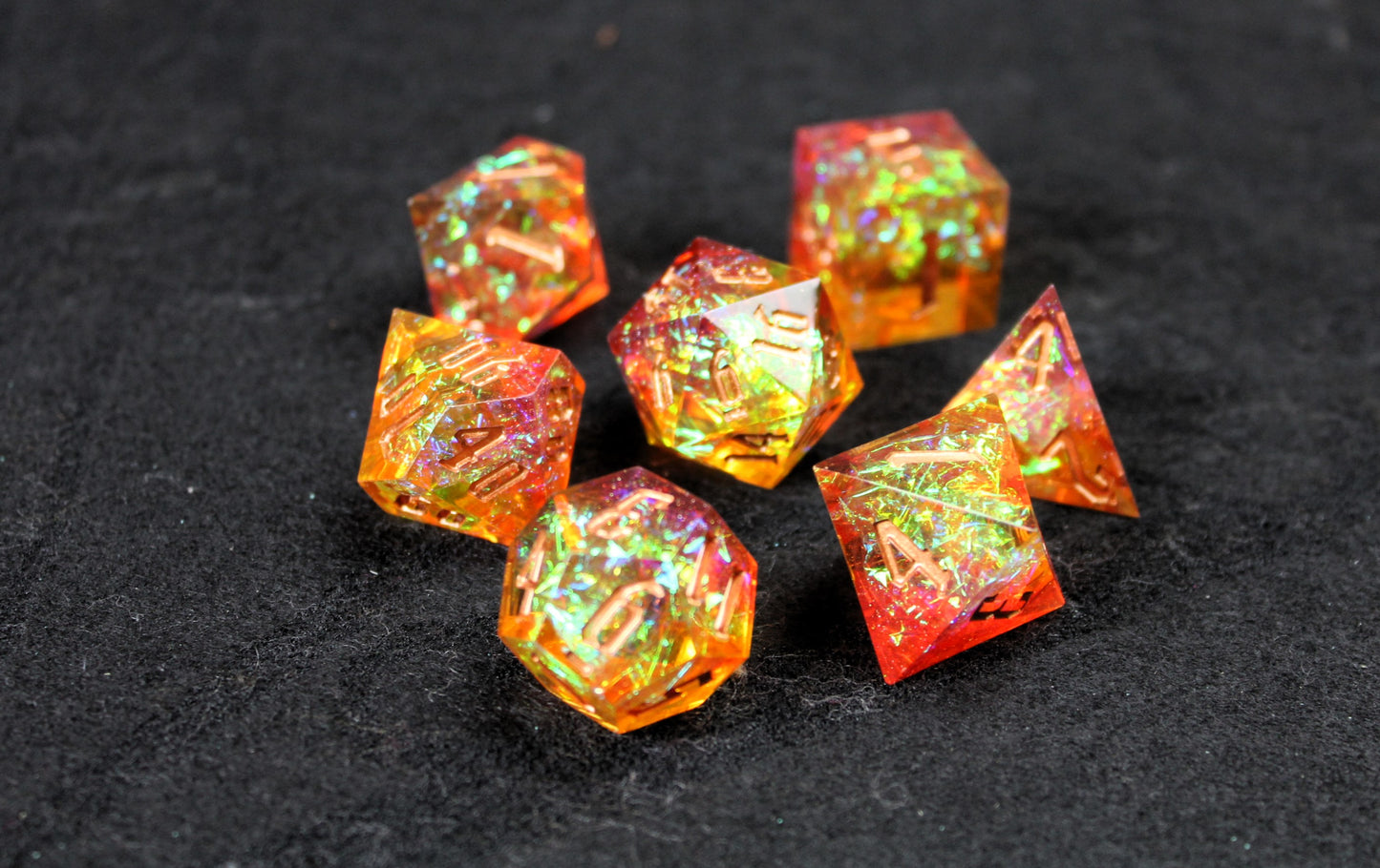Gold & Orange Glitter Sharp Edge Dice Set
Polished luxury sharp edge dice set
Roll in style with these polyhedral dice sets perfect for Tabletop games and RPG's such as pathfinder or dungeons and dragons.
This set includes one of each D20, D12, D10, D%, D8, D6, D4.
Available both with or without a PU leather dice storage box.