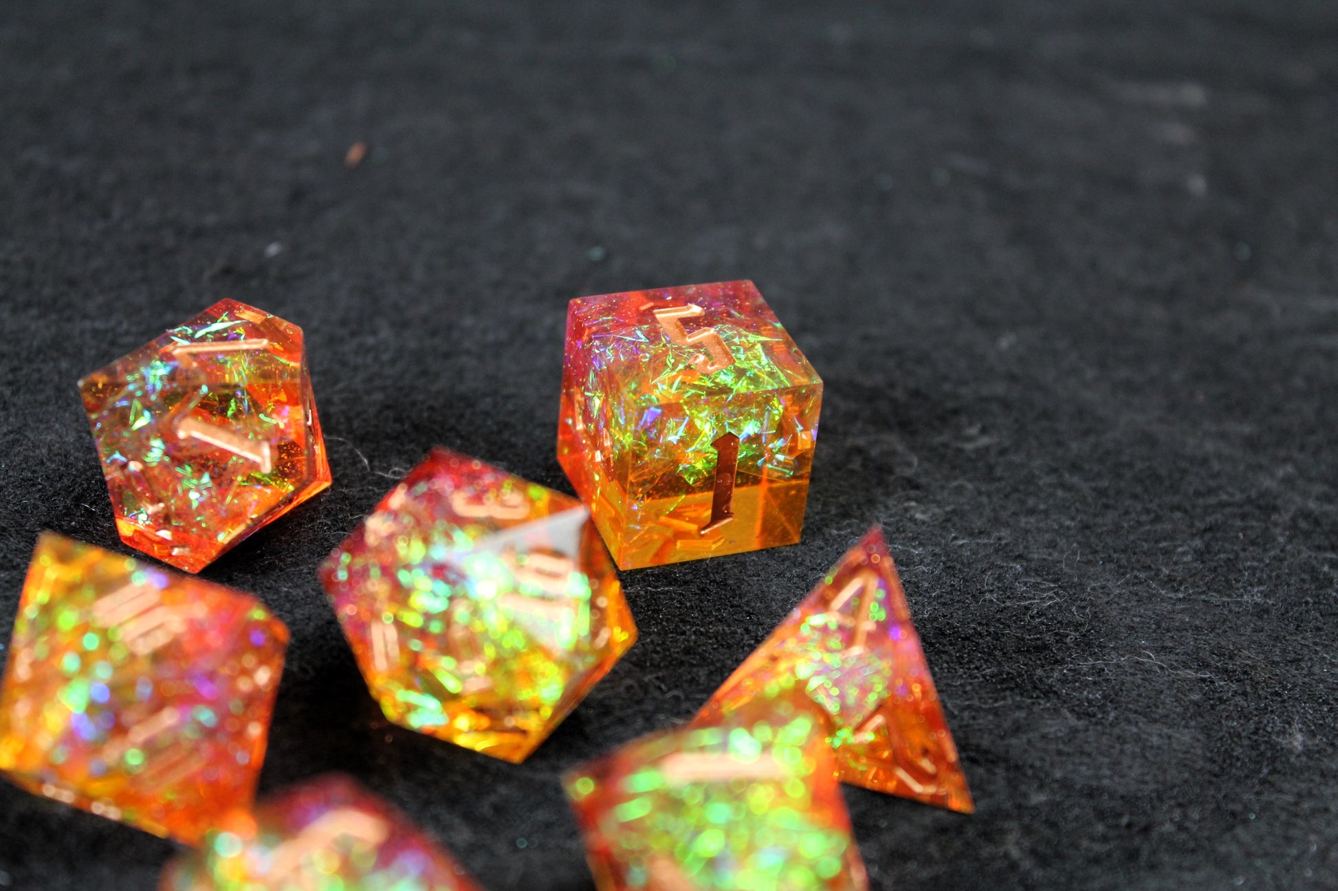 Gold & Orange Glitter Sharp Edge Dice Set
Polished luxury sharp edge dice set
Roll in style with these polyhedral dice sets perfect for Tabletop games and RPG's such as pathfinder or dungeons and dragons.
This set includes one of each D20, D12, D10, D%, D8, D6, D4.
Available both with or without a PU leather dice storage box.