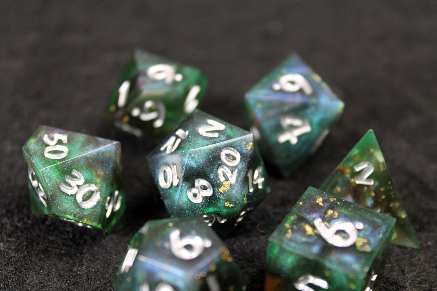 Dark Green Swirl Sharp Edge Dice Set
Polished luxury sharp edge dice set
Roll in style with these polyhedral dice sets perfect for Tabletop games and RPG's such as pathfinder or dungeons and dragons.
This set includes one of each D20, D12, D10, D%, D8, D6, D4.
Available both with or without a PU leather dice storage box.
