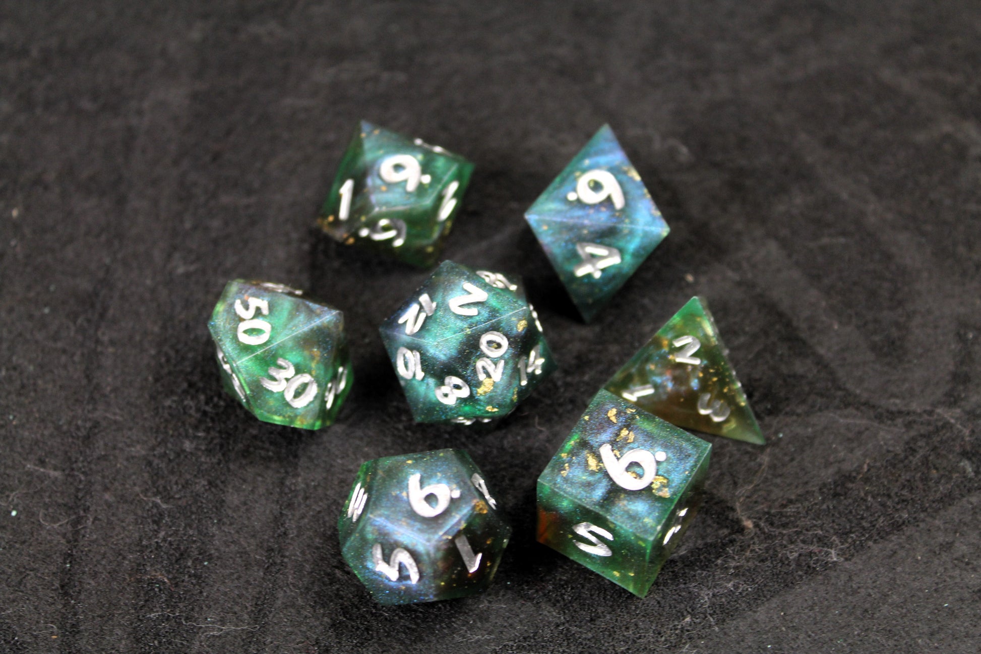 Dark Green Swirl Sharp Edge Dice Set
Polished luxury sharp edge dice set
Roll in style with these polyhedral dice sets perfect for Tabletop games and RPG's such as pathfinder or dungeons and dragons.
This set includes one of each D20, D12, D10, D%, D8, D6, D4.
Available both with or without a PU leather dice storage box.
