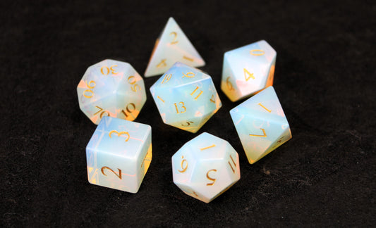 Opalite Gemstone Dice Set
Polished Opalite gemstone with gold numbers dice set
Roll in style with these polyhedral dice sets perfect for Tabletop games and RPG's such as pathfinder or dungeons and dragons.
This set includes one of each D20, D12, D10, D%, D8, D6, D4.
Available both with or without a PU leather dice storage box.