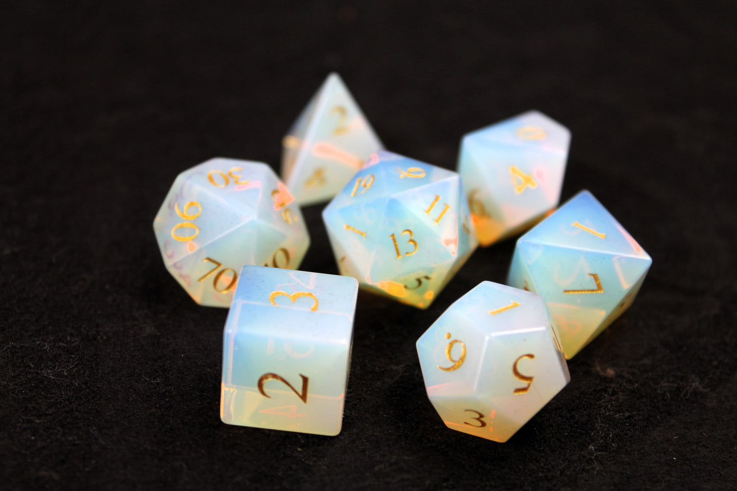 Opalite Gemstone Dice Set
Polished Opalite gemstone with gold numbers dice set
Roll in style with these polyhedral dice sets perfect for Tabletop games and RPG's such as pathfinder or dungeons and dragons.
This set includes one of each D20, D12, D10, D%, D8, D6, D4.
Available both with or without a PU leather dice storage box.