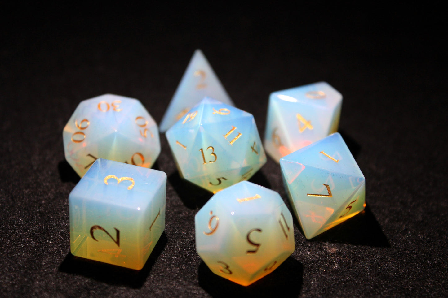 Opalite Gemstone Dice Set
Polished Opalite gemstone with gold numbers dice set
Roll in style with these polyhedral dice sets perfect for Tabletop games and RPG's such as pathfinder or dungeons and dragons.
This set includes one of each D20, D12, D10, D%, D8, D6, D4.
Available both with or without a PU leather dice storage box.