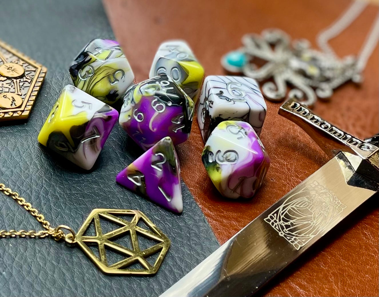 Gates of Oblivion Marble Polyhedral Dice Set March of the Gates of Oblivion with these white, black, grey, purple and yellow marbled resin polyhedral dice set. They are standard 16mm polyhedral dice sets perfect for Tabletop games and RPG's such as pathfinder or dungeons and dragons. This set includes one of each D20, D12, D10, D%, D8, D6, D4.