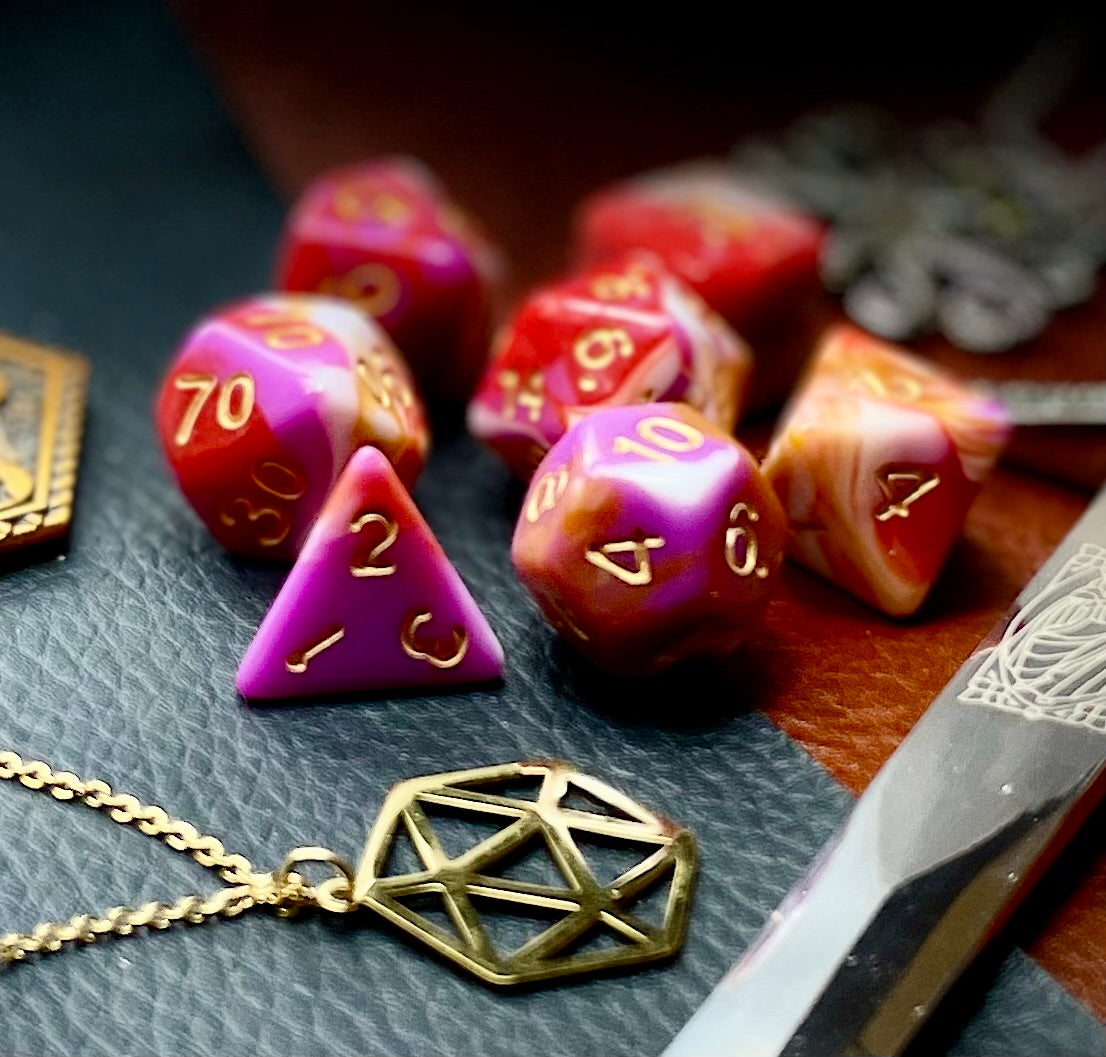 Pavlova Polyhedral Dice Set Roll sweetly with these white, pink, orange and red marbled resin polyhedral dice set. They are standard 16mm polyhedral dice sets perfect for Tabletop games and RPG's such as pathfinder or dungeons and dragons. This set includes one of each D20, D12, D10, D%, D8, D6, D4.
