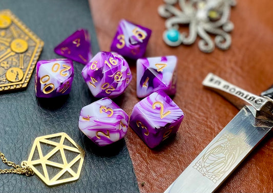 Purple and White Marble Polyhedral Dice Set  Roll with style with these purple and white marbled resin polyhedral dice set.  They are standard 16mm polyhedral dice sets perfect for Tabletop games and RPG's such as pathfinder or dungeons and dragons.  This set includes one of each D20, D12, D10, D%, D8, D6, D4.