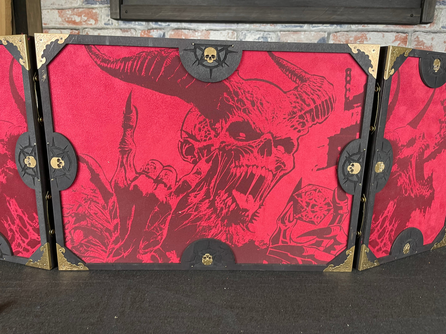 Dice With The Devil Dungeon Master Screen is a must-have for any tabletop gaming enthusiast. Crafted from high-quality wood and engraved with intricate designs, this screen is both sturdy and visually stunning. Ideal for tabletop gaming, Dungeons and Dragons, Pathfinder and many other TTRPG's