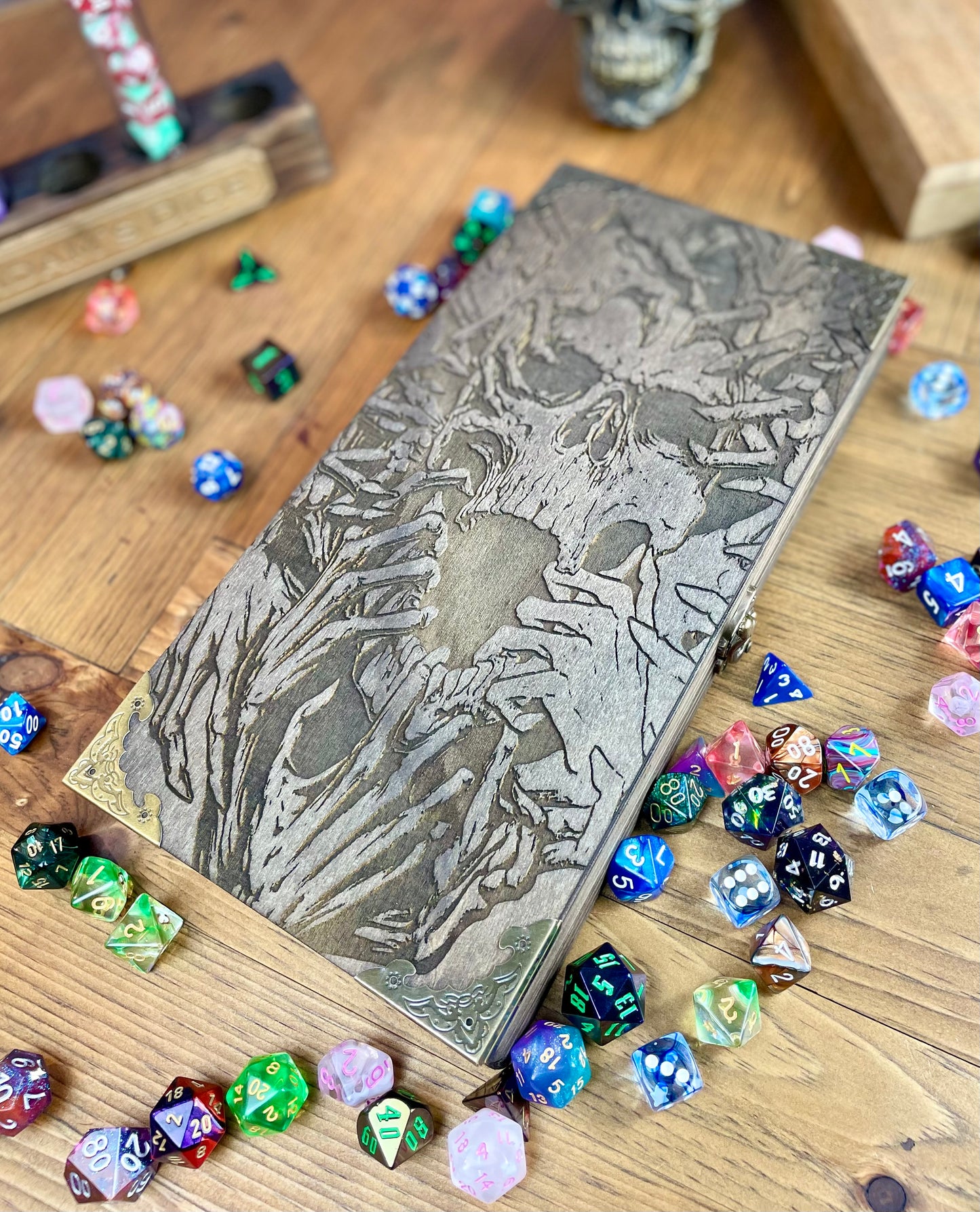 Necromancers Vault Dice Box, Accessory Storage and Roll Tray. Hand finished dice box for storing dice, cards, counters and accessories with handy pen storage and in built roll tray. Choose from 8 vibrant colour finished to make your box unique to you. Complete with our unique necromancy inspired design, metal corner protectors and clasp