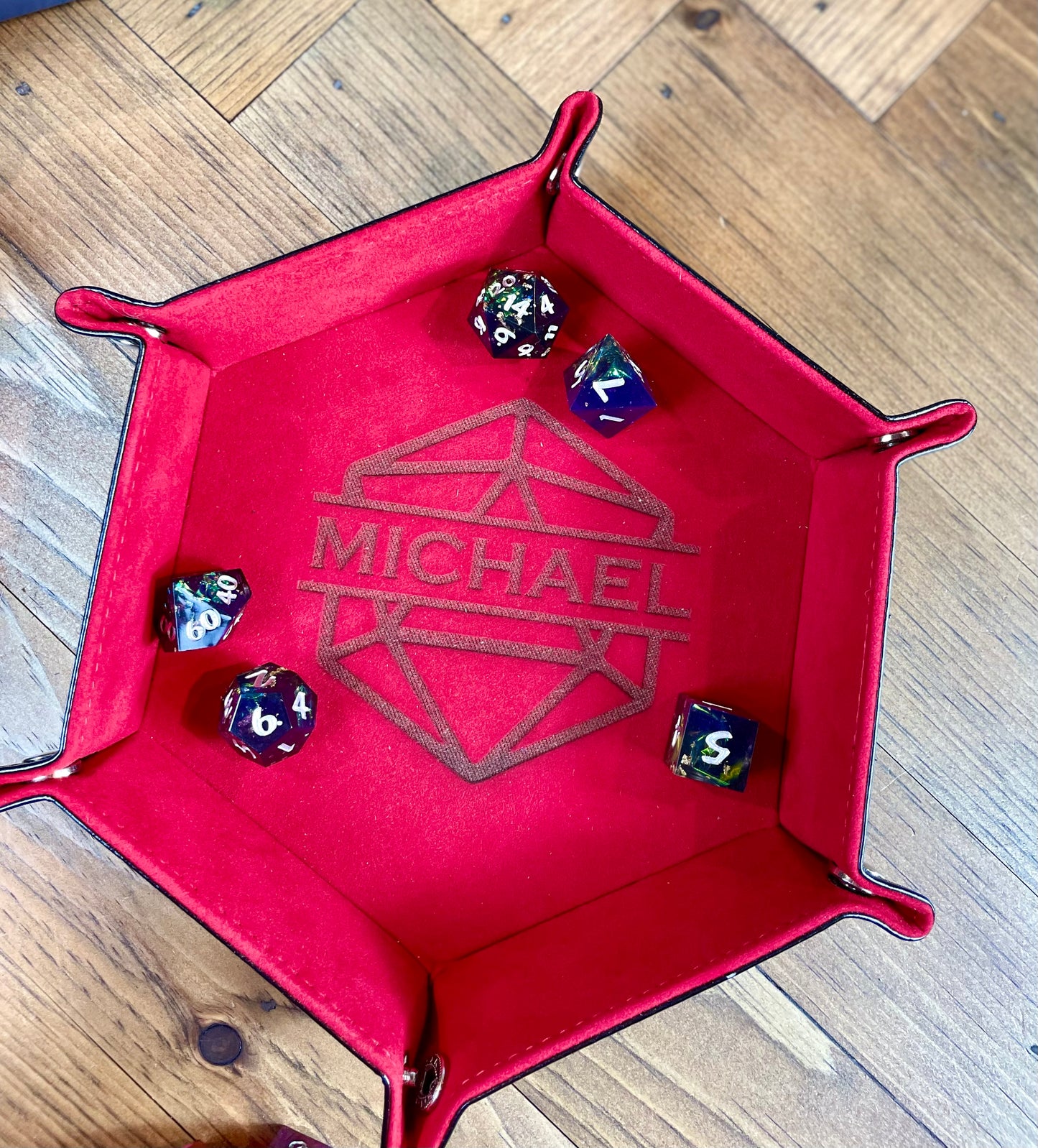 Personalised Hexagon Dice Tray Stud fixing lay flat dice rolling tray. With a PU leather outside and a velour inside in a choice of 3 vibrant colours; these trays are easy to transport and store while looking great. 
