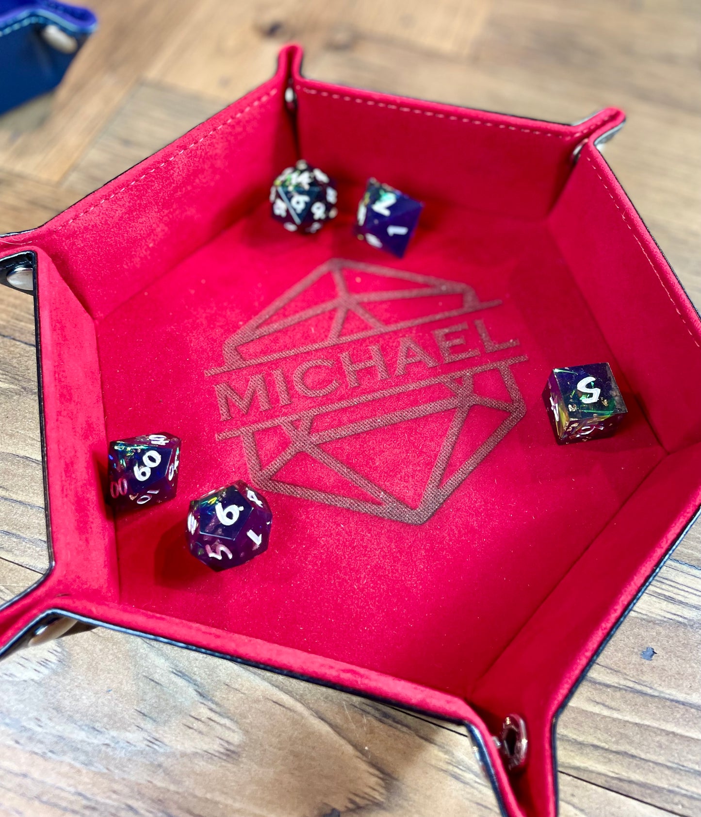 Personalised Hexagon Dice Tray Stud fixing lay flat dice rolling tray. With a PU leather outside and a velour inside in a choice of 3 vibrant colours; these trays are easy to transport and store while looking great. 
