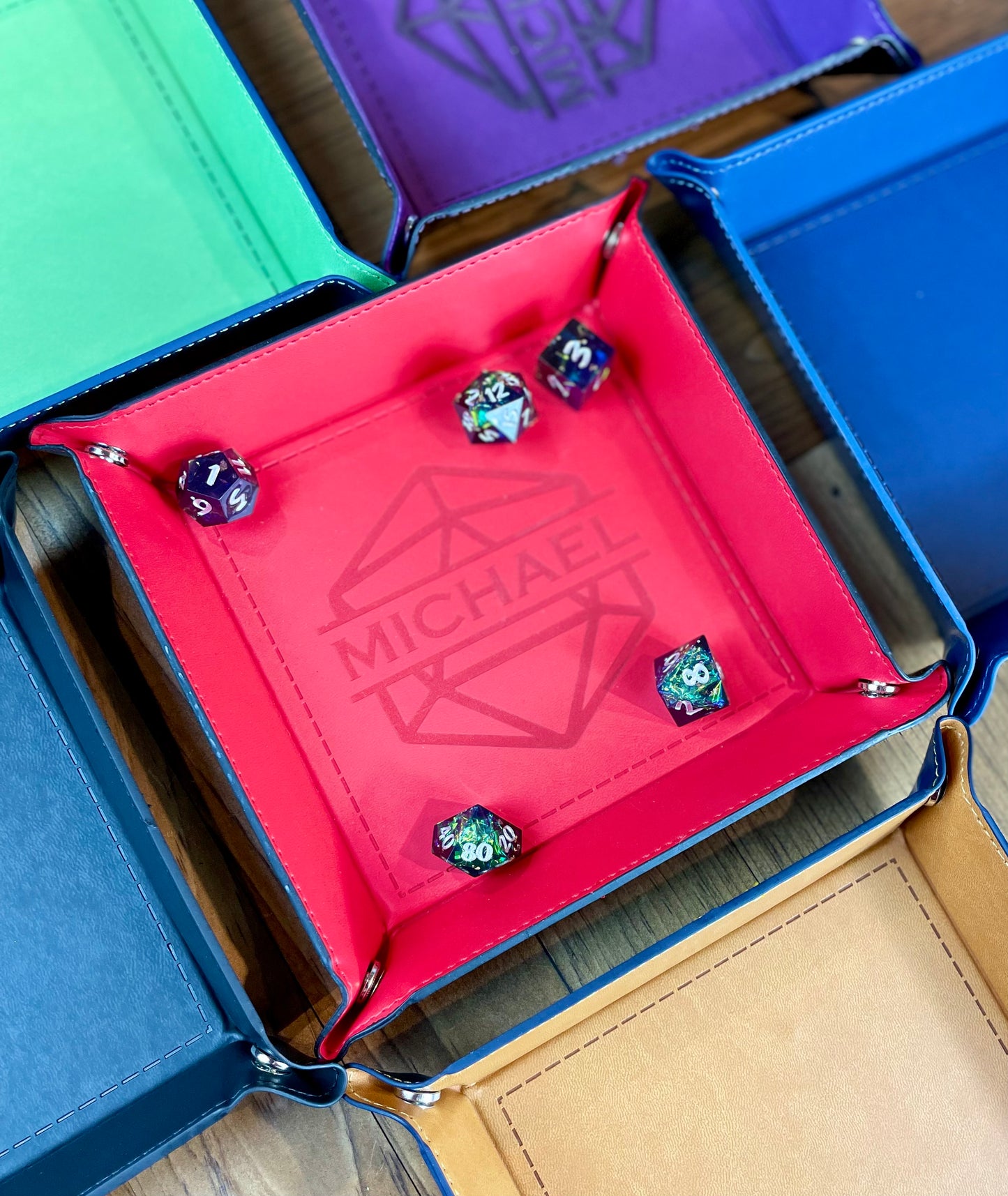 ersonalised Square Dice Tray Stud fixing lay flat dice rolling tray. Made from PU leather and available in a choice of 6 vibrant colours; these trays are easy to transport and store while looking great. Engrave your tray with a choice of 24 different designs. 