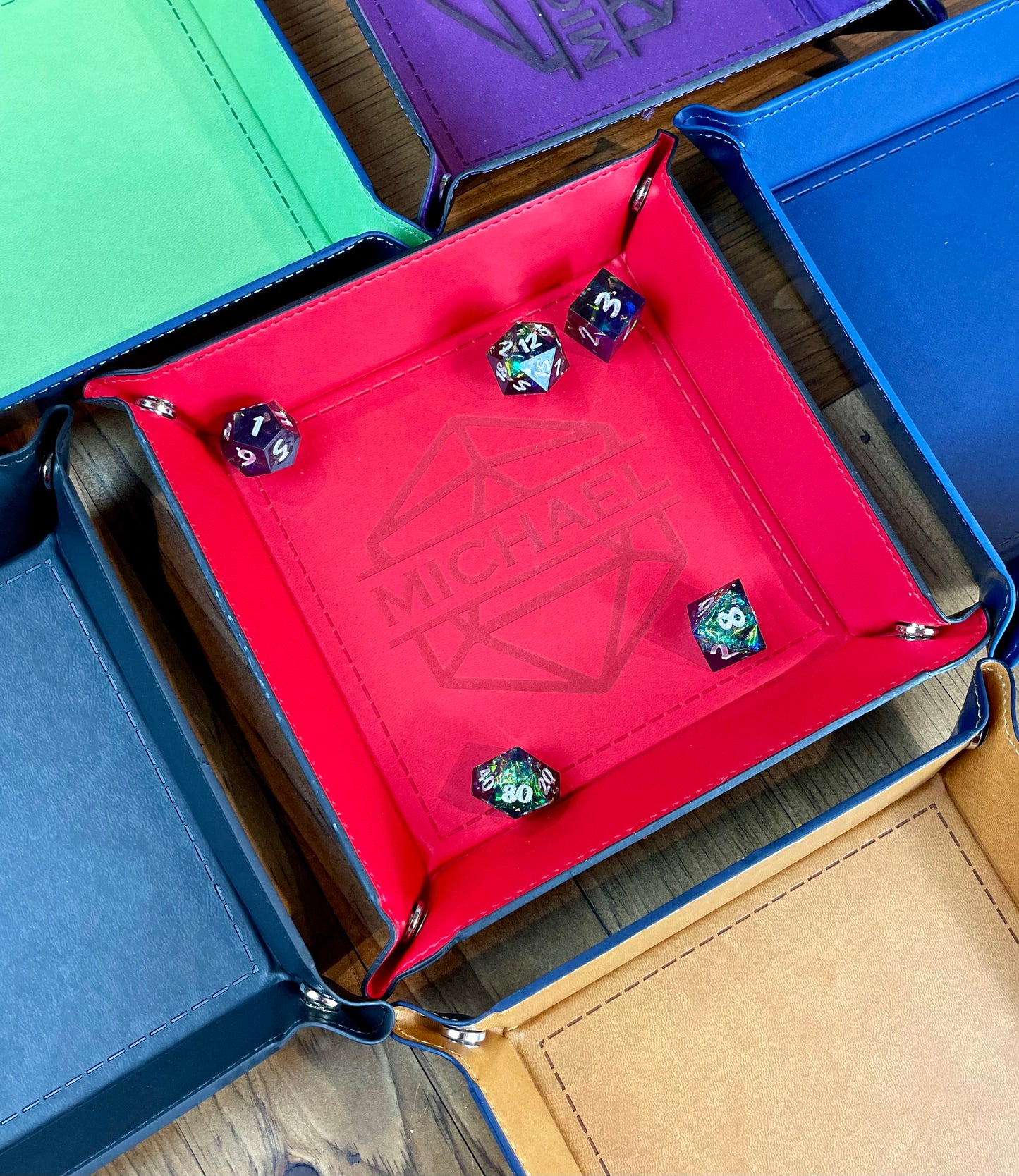 ersonalised Square Dice Tray Stud fixing lay flat dice rolling tray. Made from PU leather and available in a choice of 6 vibrant colours; these trays are easy to transport and store while looking great. Engrave your tray with a choice of 24 different designs. 