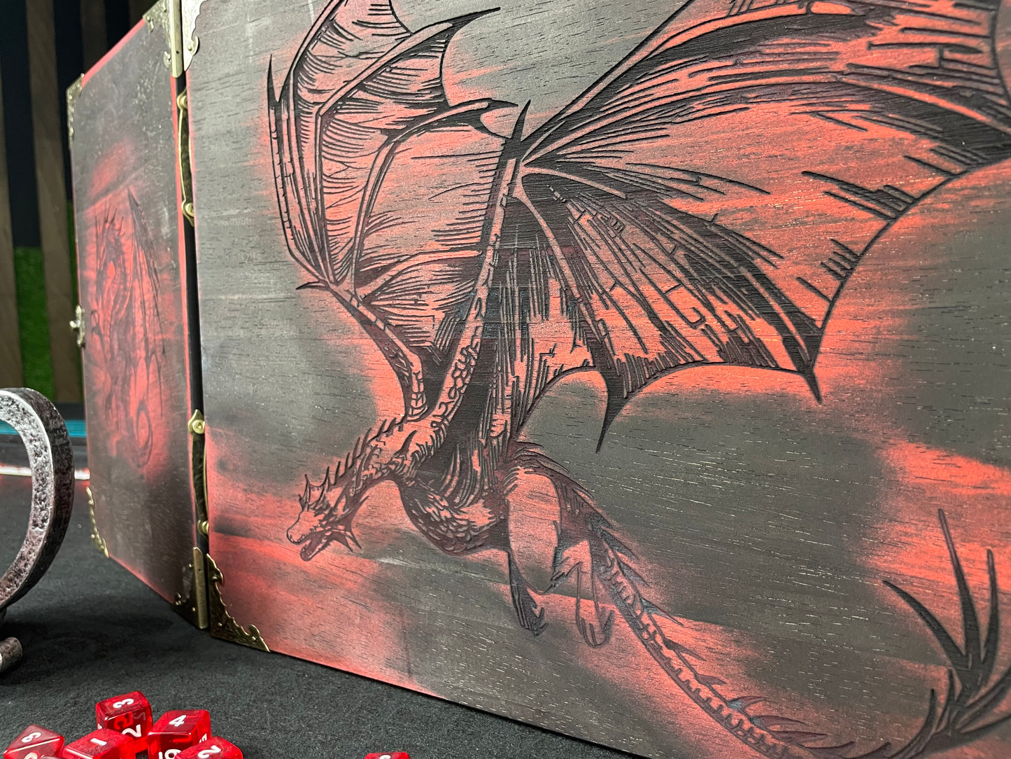Fire Dragon DM Screen Our brand new addition to our range of screens Featuring our 3 fire dragons, the screen's 3 sections fold on hinges and has an antique effect catch for easy storage. Each screen is painted black before accenting the design in one of 4 vibrant colours; red, green, blue or purple. We embellish the DM screen with antiqued corner protectors to save you from bumps and scrapes. 