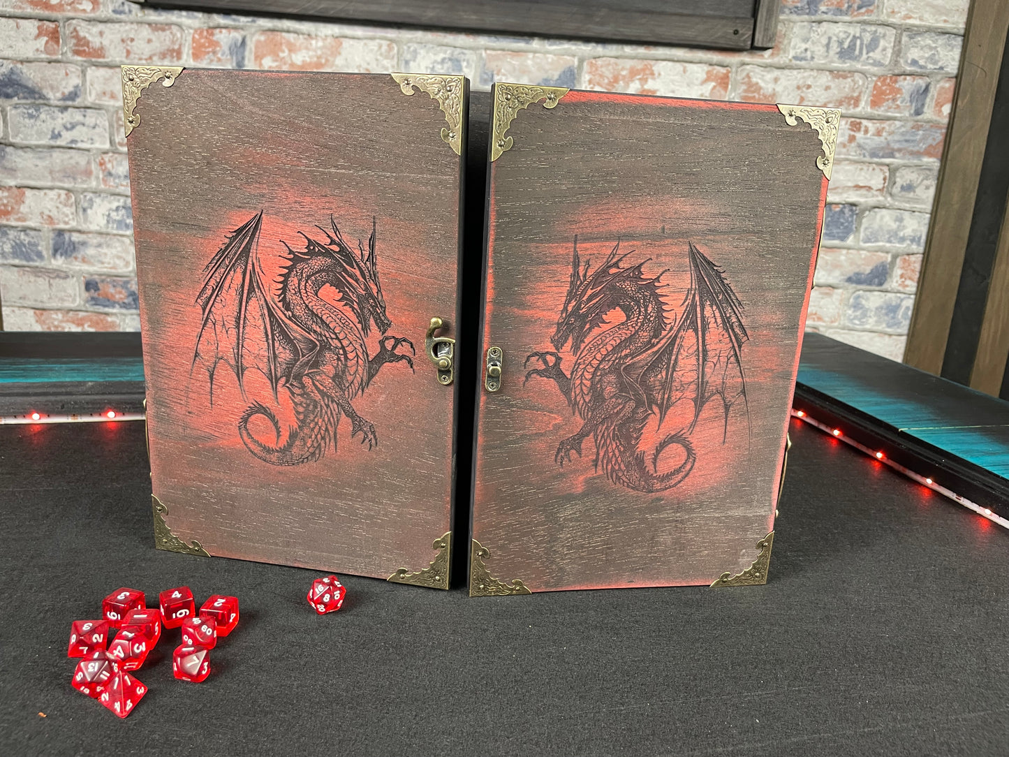 Fire Dragon DM Screen Our brand new addition to our range of screens Featuring our 3 fire dragons, the screen's 3 sections fold on hinges and has an antique effect catch for easy storage. Each screen is painted black before accenting the design in one of 4 vibrant colours; red, green, blue or purple. We embellish the DM screen with antiqued corner protectors to save you from bumps and scrapes. 
