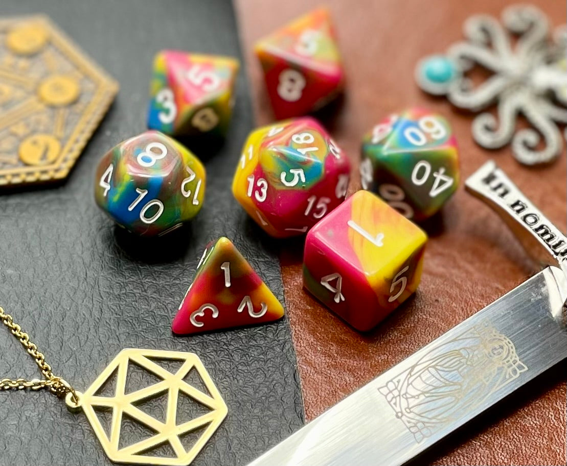 Rock Candy Polyhedral Dice Set Roll sweetly with these pink, blue and yellow marbled resin polyhedral dice set. They are standard 16mm polyhedral dice sets perfect for Tabletop games and RPG's such as pathfinder or dungeons and dragons. This set includes one of each D20, D12, D10, D%, D8, D6, D4.