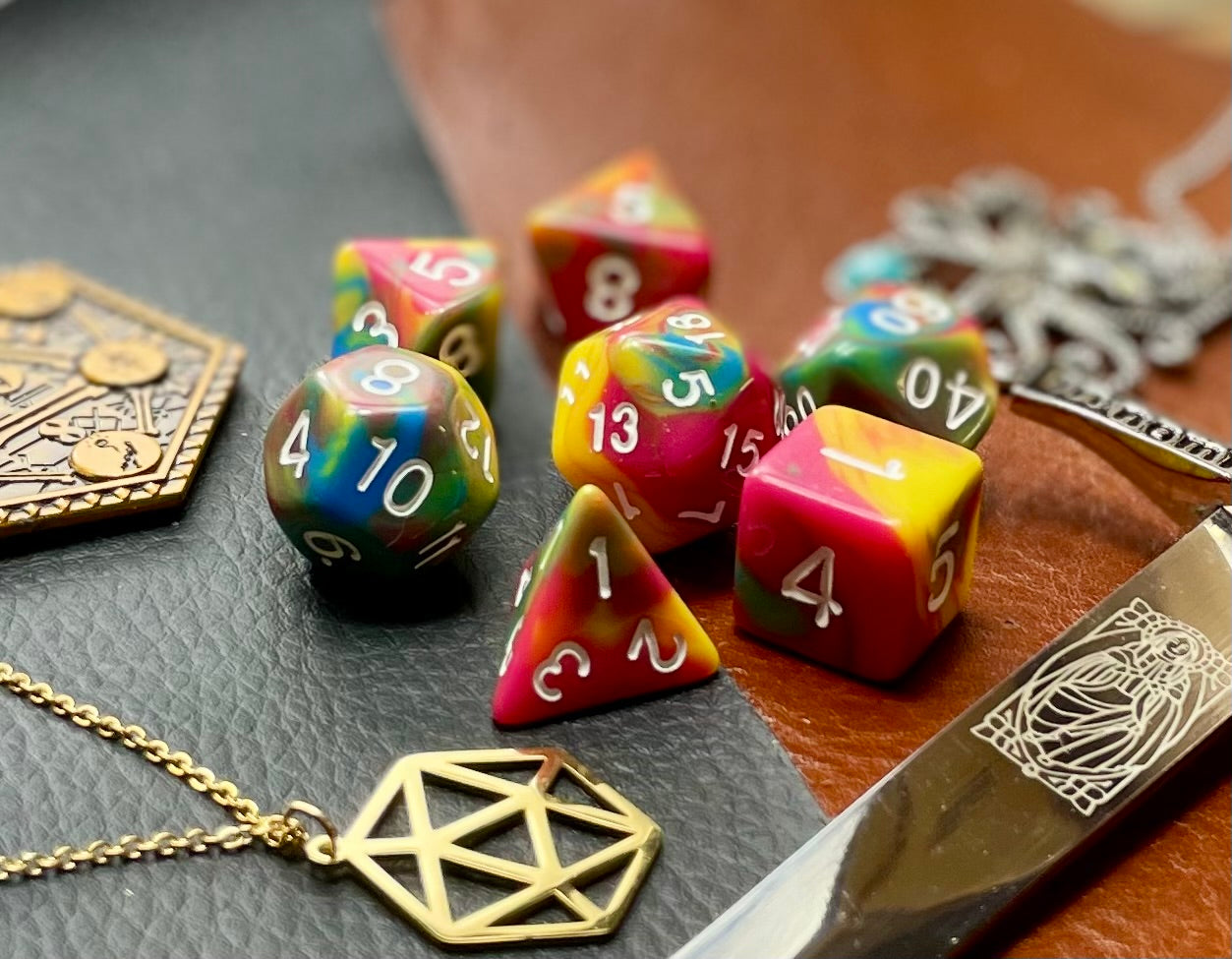 Rock Candy Polyhedral Dice Set Roll sweetly with these pink, blue and yellow marbled resin polyhedral dice set. They are standard 16mm polyhedral dice sets perfect for Tabletop games and RPG's such as pathfinder or dungeons and dragons. This set includes one of each D20, D12, D10, D%, D8, D6, D4.