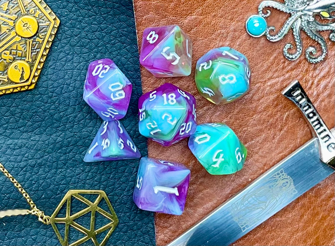 Sea Elves Polyhedral Dice Set Take to the seas with these purple and green marbled resin polyhedral dice set. They are standard 16mm polyhedral dice sets perfect for Tabletop games and RPG's such as pathfinder or dungeons and dragons. This set includes one of each D20, D12, D10, D%, D8, D6, D4.
