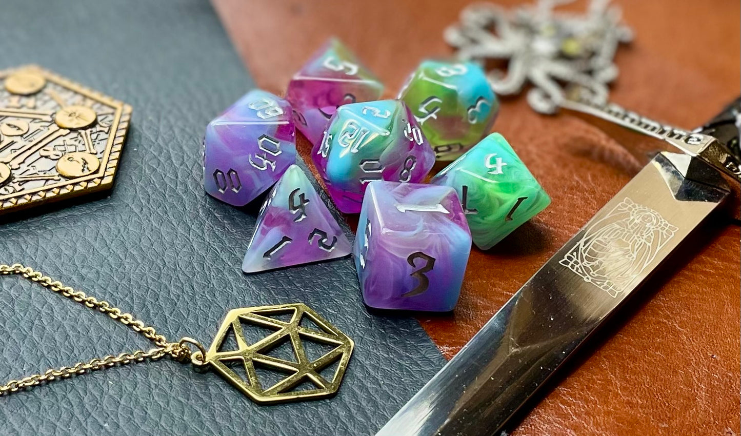 Sea Elves Polyhedral Dice Set Take to the seas with these purple and green marbled resin polyhedral dice set. They are standard 16mm polyhedral dice sets perfect for Tabletop games and RPG's such as pathfinder or dungeons and dragons. This set includes one of each D20, D12, D10, D%, D8, D6, D4.