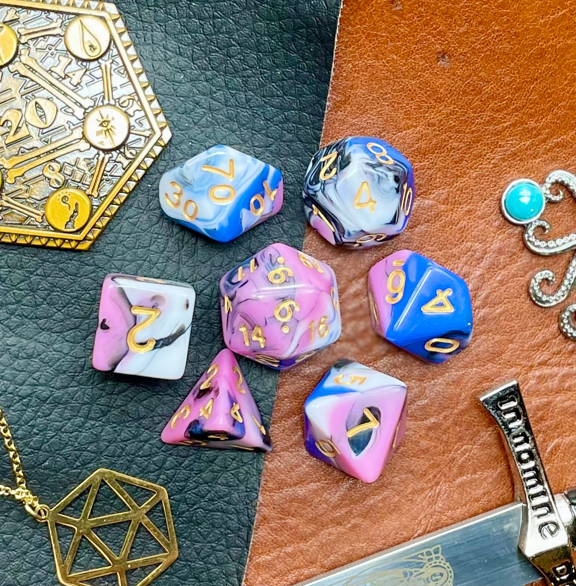 Snow Fey Polyhedral Dice Set Enter the Fey Wilds with these blue, pink, black and white marbled resin polyhedral dice set. They are standard 16mm polyhedral dice sets perfect for Tabletop games and RPG's such as pathfinder or dungeons and dragons. This set includes one of each D20, D12, D10, D%, D8, D6, D4.