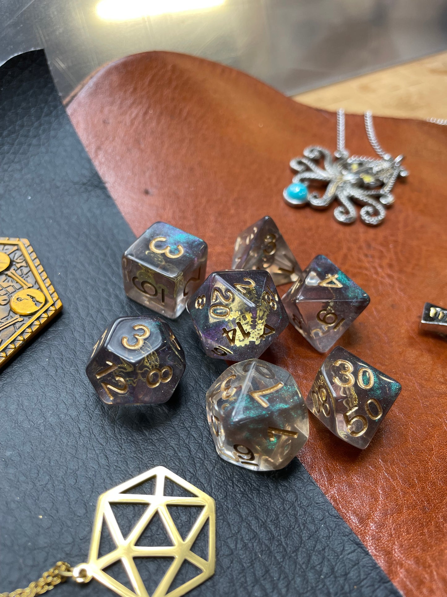 Steampunk Gold Cog Dice Set Clear resin dice set with inset steampunk style gold cogs They are 16mm polyhedral dice sets perfect for Tabletop games and RPG's such as pathfinder or dungeons and dragons. This set includes one of each D20, D12, D10, D%, D8, D6, D4. Free UK Delivery by Fandomonium