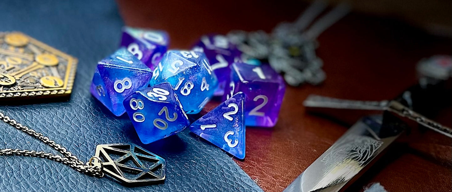 Sapphire Phantom Polyhedral Dice Sett Enter the spirit realm blue and purple swirl resin polyhedral dice set. They are standard 16mm polyhedral dice sets perfect for Tabletop games and RPG's such as pathfinder or dungeons and dragons. This set includes one of each D20, D12, D10, D%, D8, D6, D4.