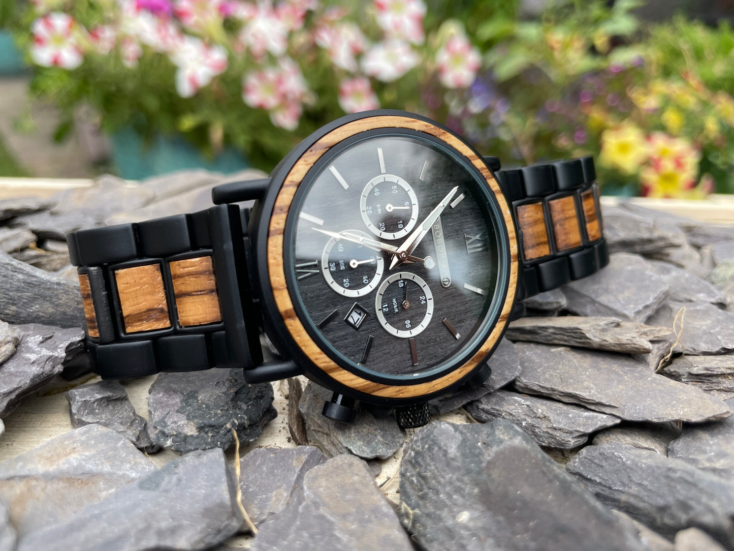 Walnut & Zebrano Interlocking Strap Self Winding Wooden Eco Watch
Made from solid walnut and zebrano, these watches are both comfortable to wear and a unique timepiece. Featuring a black metal interlocking frame strap with inlayed wooden panels to create a unique look.