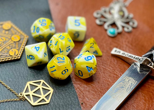 Yellow and White Marble Polyhedral Dice Set  Roll with style with these yellow and white marbled resin polyhedral dice set.  They are standard 16mm polyhedral dice sets perfect for Tabletop games and RPG's such as pathfinder or dungeons and dragons.  This set includes one of each D20, D12, D10, D%, D8, D6, D4.