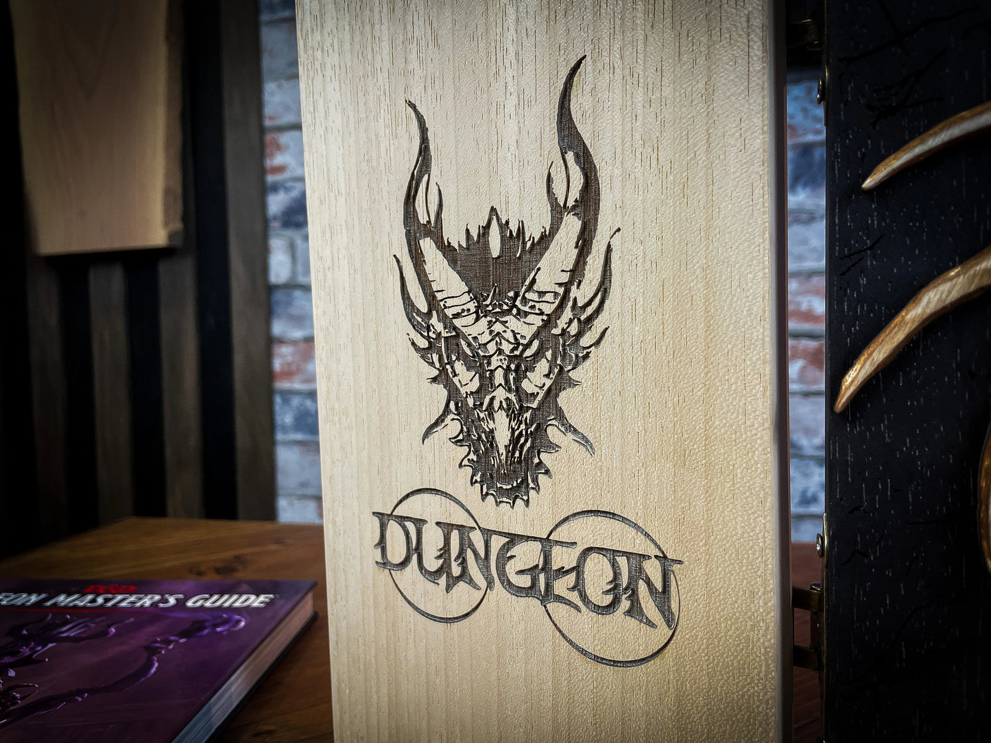 Dragon's Wrath Dungeon Master Screen. Made from solid wood and made to fold to resemble a book when not in use, this screen is stylish, fun and adds atmosphere to any game. Comprising 4 solid wood panels connected using antiqued metal hinges; they fold together to resemble a book when closed. Free UK delivery from Fandomonium